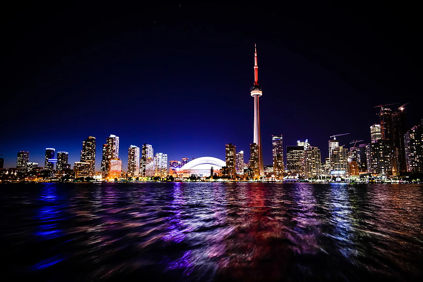 Toronto Skyline at Night with CN Tower and Water Reflections