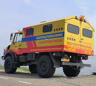 Yellow KNRM Search and Rescue Truck by the Sea