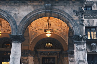 Ornate Historic Stone Archway with Decorative Ceiling