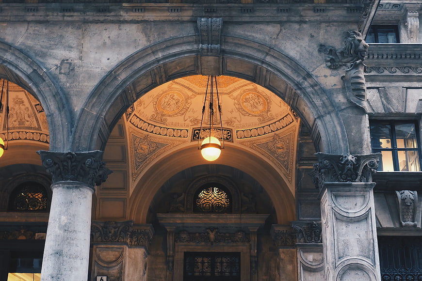 Ornate Historic Stone Archway with Decorative Ceiling