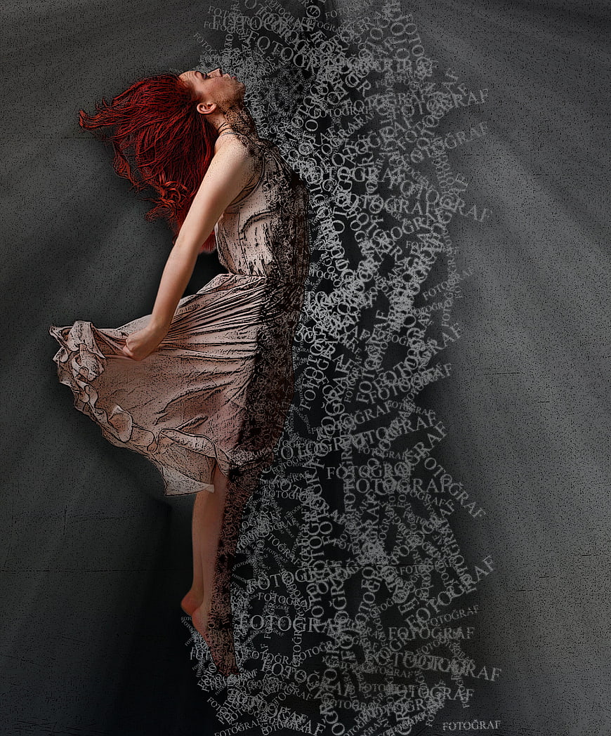 Woman with red hair dissolving into typography text