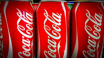 Close-up of red Coca-Cola cans in a row