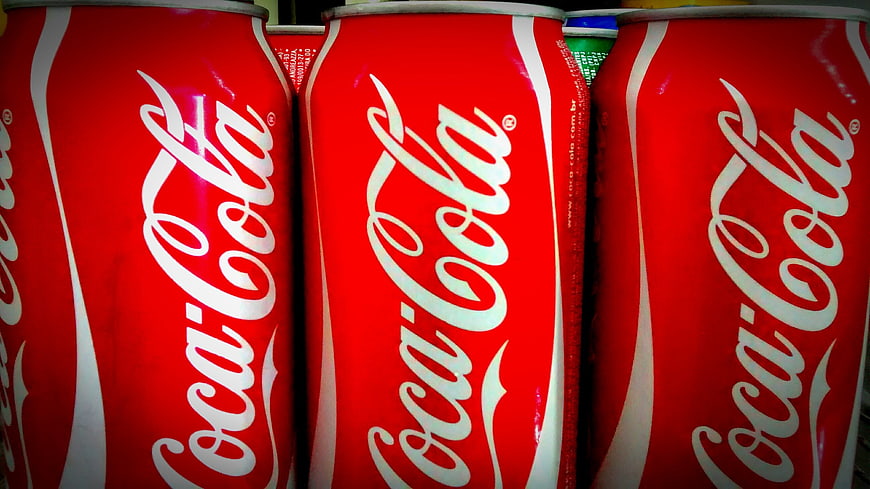 Close-up of red Coca-Cola cans in a row