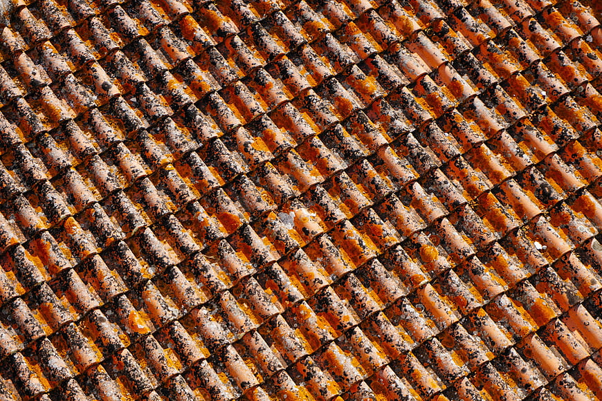 Textured Pattern of Weathered Orange Roof Tiles