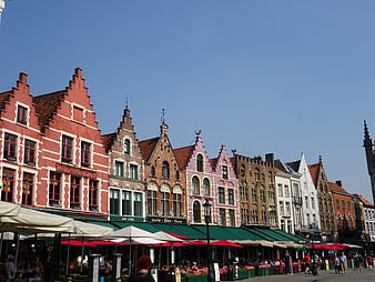 Colorful historic gabled buildings in Bruges market square