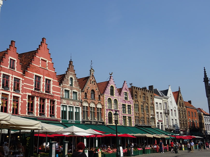 Colorful historic gabled buildings in Bruges market square