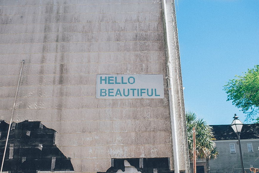 Hello Beautiful Sign on Weathered Building Wall