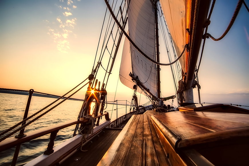 Wooden Sailboat Deck at Golden Sunset on the Ocean