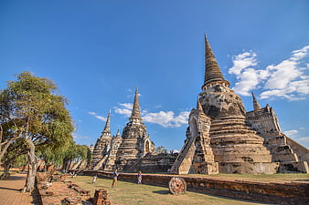 Ancient Thai Temple Ruins with Blue Sky