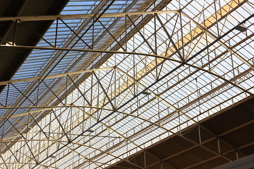 Low angle view of intricate metal roof structure at Sao Bento Station