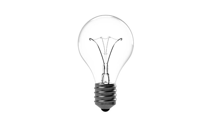Clear incandescent light bulb on white background