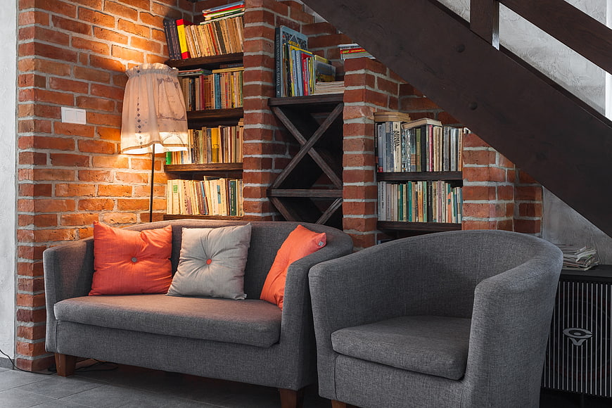 Cozy Reading Nook with Brick Wall and Bookshelves