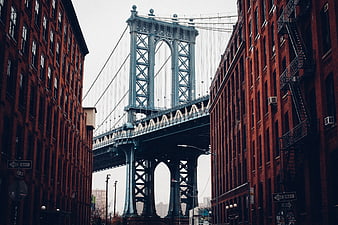 Manhattan Bridge View Between Red Brick Buildings