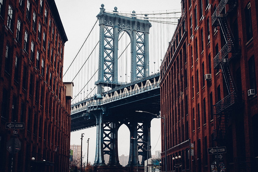 Manhattan Bridge View Between Red Brick Buildings