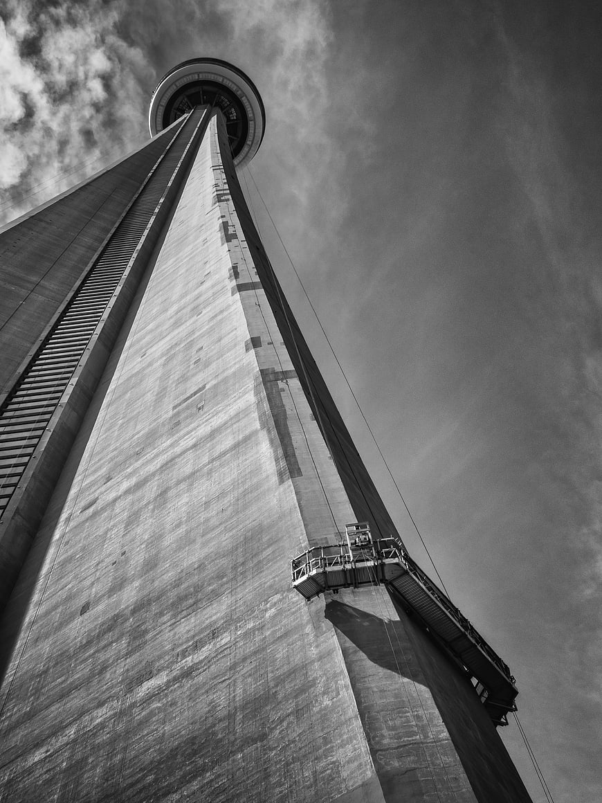 Low angle black and white view of concrete observation tower