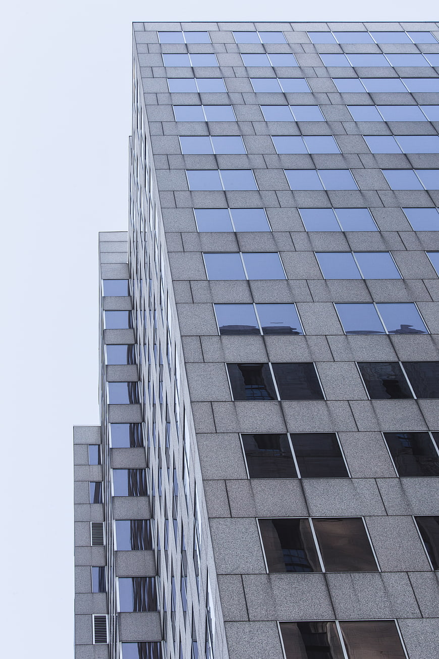 Low angle view of modern office building facade with windows