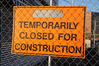 Temporarily Closed for Construction Sign on Chain Link Fence