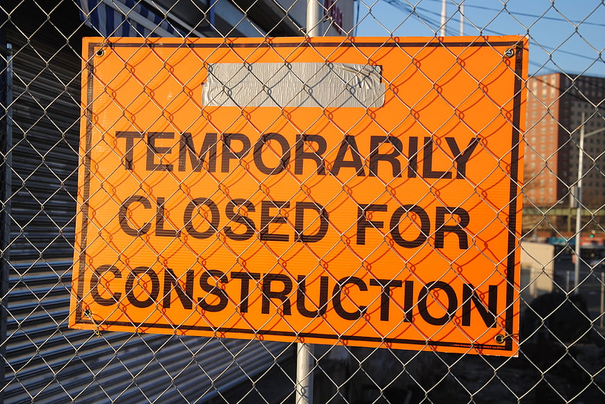 Temporarily Closed for Construction Sign on Chain Link Fence