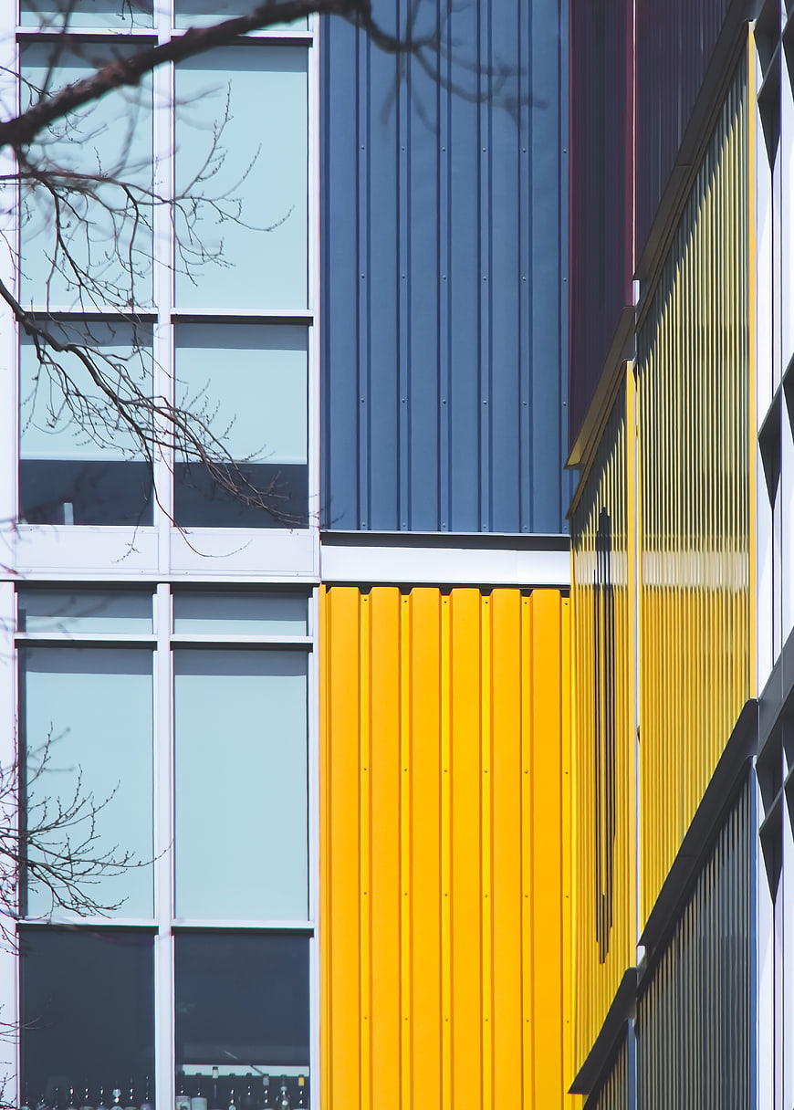 Modern Building Facade with Yellow and Blue Panels