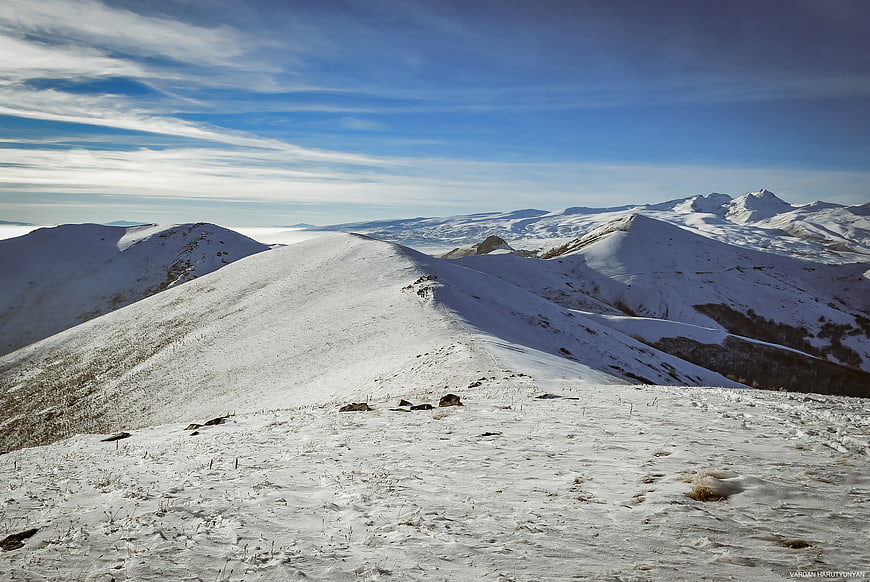 Snowy Mountain Ridge Landscape with Blue Sky