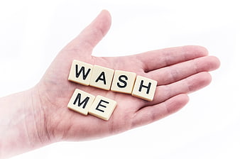 Hand Holding Scrabble Tiles Spelling Wash Me