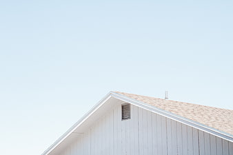 Minimalist White House Roof Against Clear Blue Sky