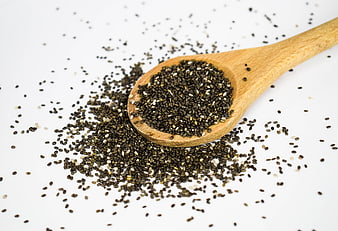 Wooden Spoon with Chia Seeds on White Background