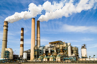 Industrial Power Plant Smokestacks Emitting Steam