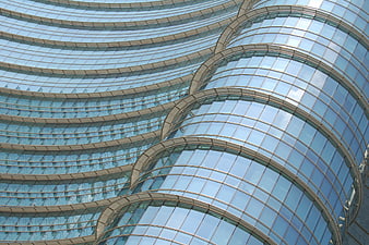 Curved glass facade of modern office building
