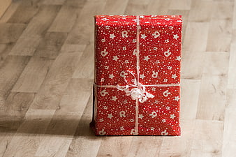 Red Christmas Gift Box on Wooden Floor