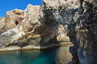 Natural Rock Arch Over Turquoise Water in Cyprus