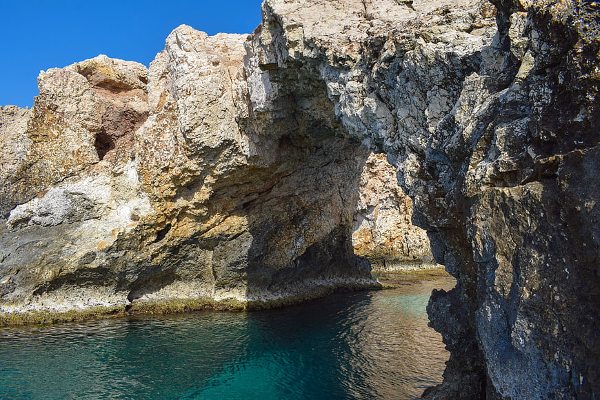 Natural Rock Arch Over Turquoise Water in Cyprus