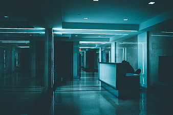 Empty modern office hallway with blue neon lighting