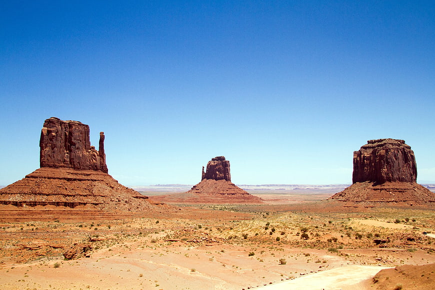 Monument Valley Buttes Under Clear Blue Sky