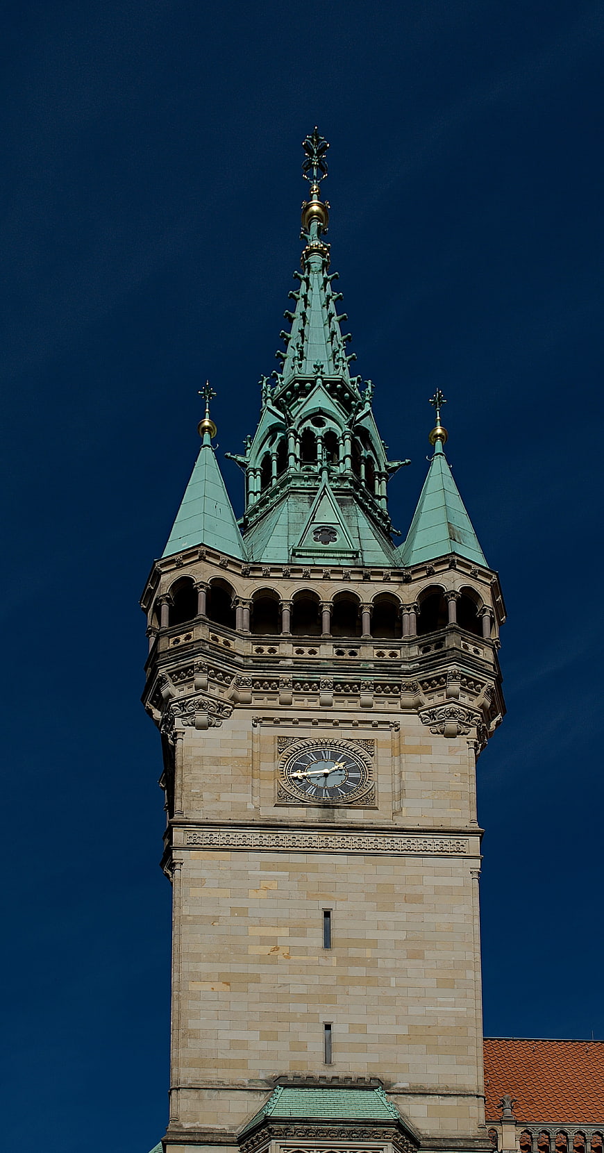 Gothic Clock Tower Spire Against Deep Blue Sky