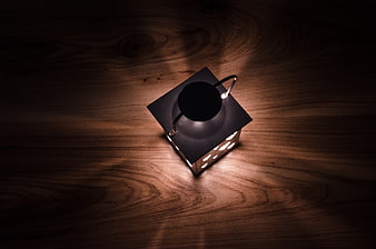 Vintage Metal Lantern Glowing on Dark Wooden Table