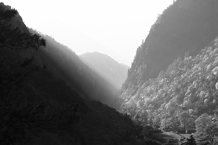 Dramatic Black and White Mountain Valley with Sunbeams