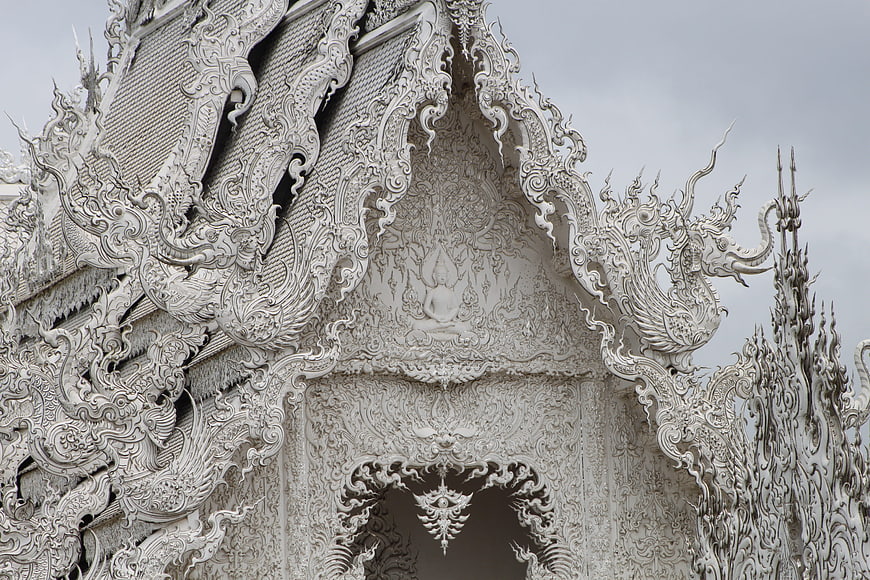 Intricate White Temple Architecture Detail in Chiang Rai