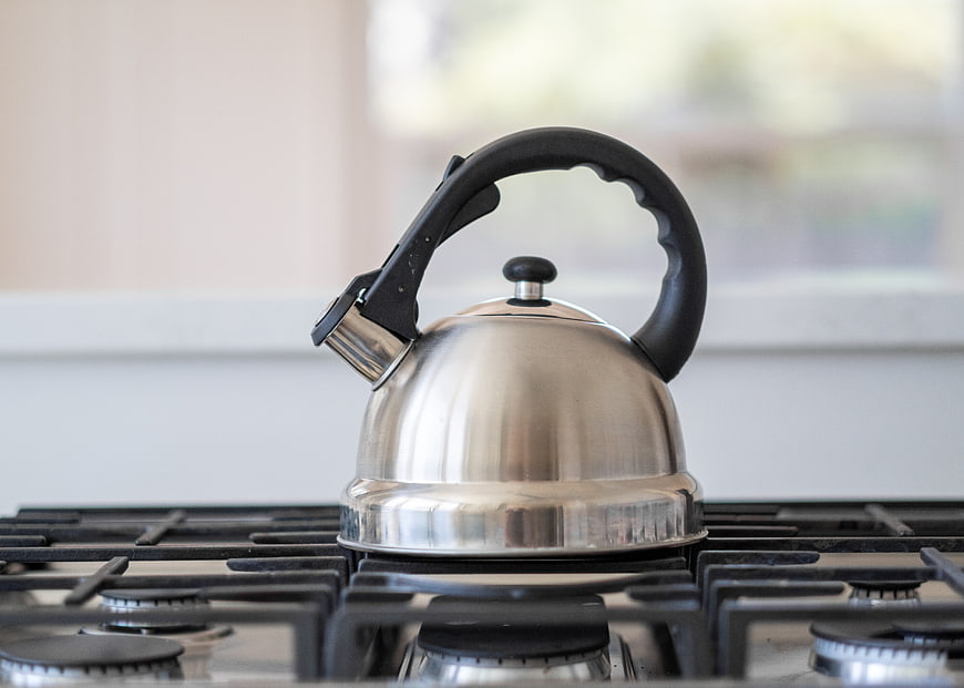 Stainless Steel Kettle on Gas Stove Burner