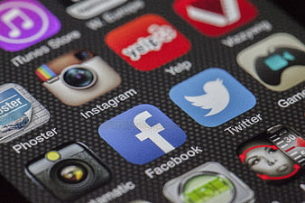 Close-up of smartphone screen with social media app icons