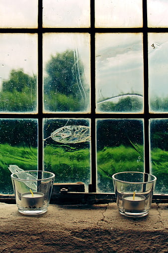 Two Tealight Candles on Rustic Window Sill