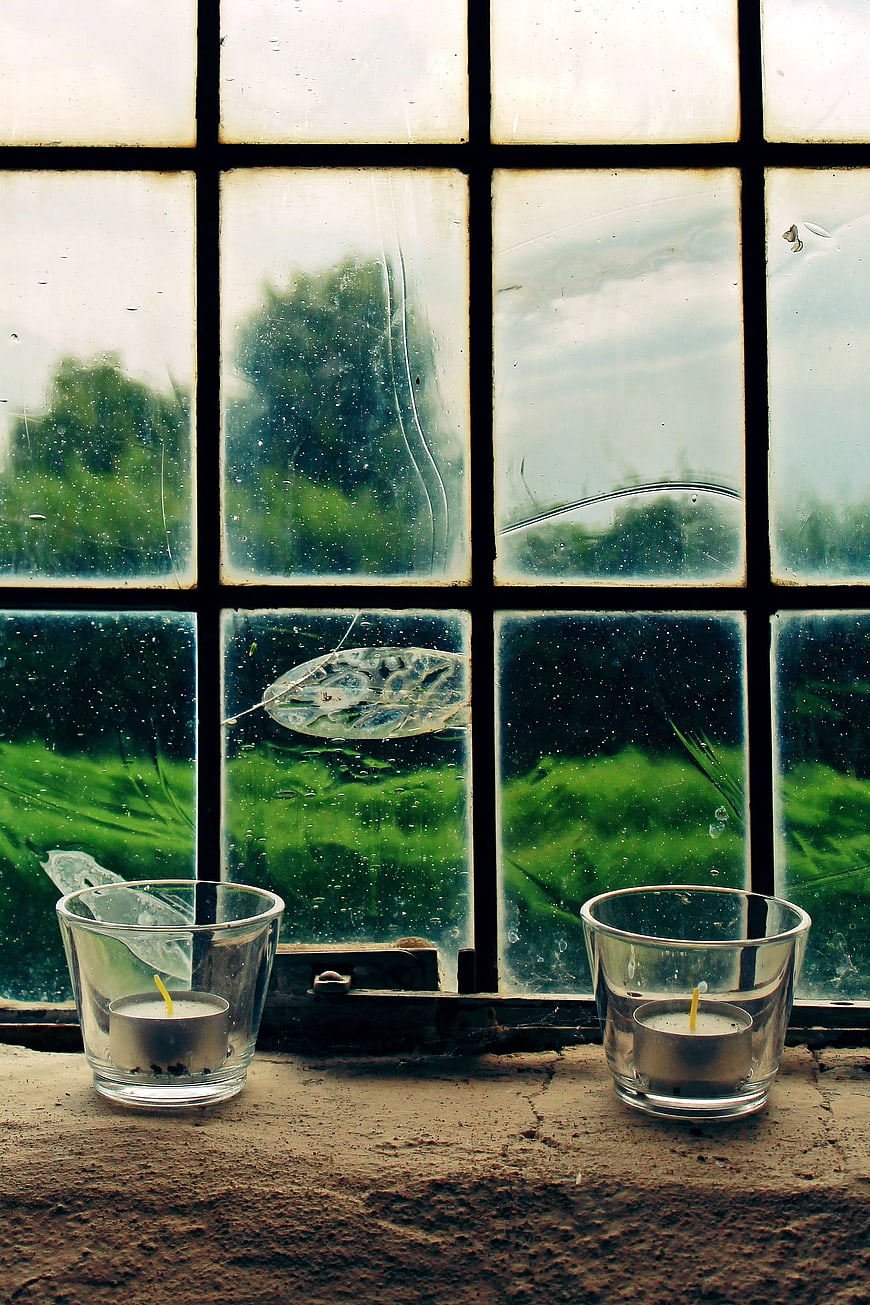 Two Tealight Candles on Rustic Window Sill