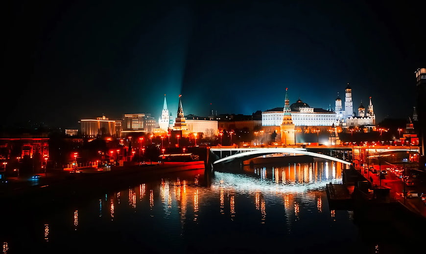 Moscow Kremlin Night View with Illuminated Towers and River Reflections