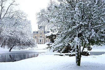 Snowy Winter Landscape with Chateau and Frozen Pond
