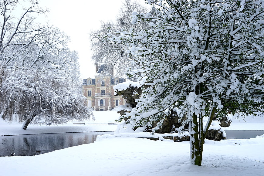 Snowy Winter Landscape with Chateau and Frozen Pond