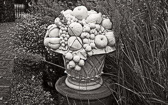 Black and white stone fruit urn garden sculpture