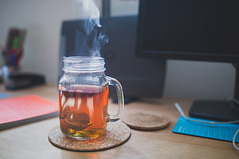 Steaming Hot Tea in Mason Jar on Office Desk
