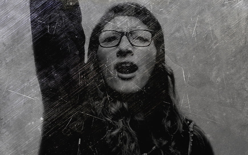 Black and White Portrait of Shouting Woman With Raised Arm