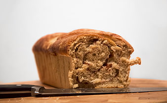 Freshly Baked Cinnamon Swirl Bread Loaf with Knife