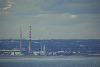 Industrial Power Plant Chimneys by the Water